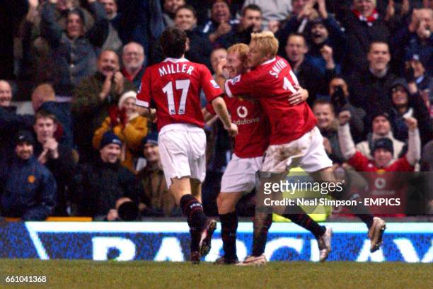 Manchester United's Paul Scholes is congratulated by Liam Miller and Alan Smith after scoring their second goal