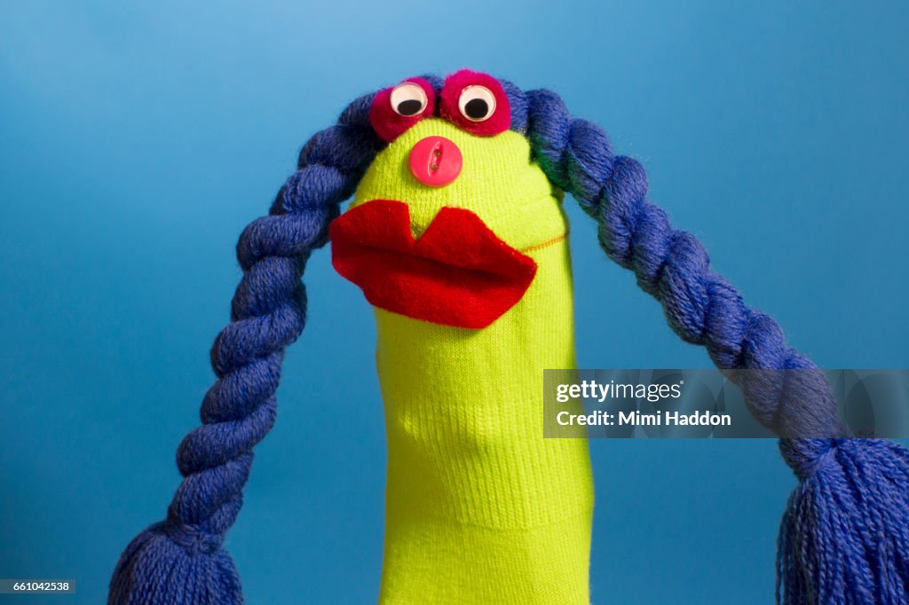 Green Sock Puppet with Blue Braided hair and Big Red Lips