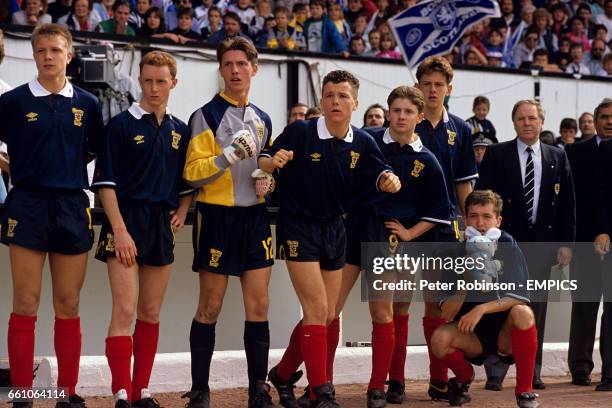 Scotland's David Hagen, Ian Downie, Martin Dickson, William Dolan, Craig Flannigan, Kevin McGoldrick, Edward Conville and manager Craig Brown watch...