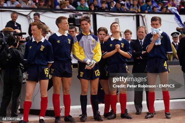 Scotland's Ian Downie, David Hagen, Martin Dickson, Craig Flannigan, William Dolan, manager Craig Brown and Edward Conville can only watch and pray...