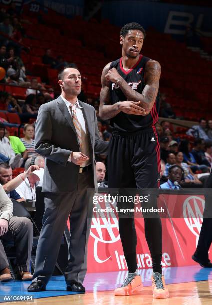 Nevada Smith, head coach of the Sioux Falls Skyforce speaks to Greg Whittington as the take on the Oklahoma City Blue during an NBA D-League game on...