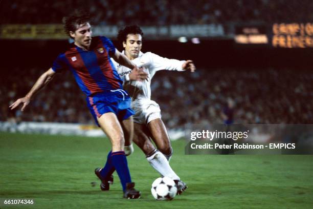 Barcelona's Migueli holds off Real Madrid's Hugo Sanchez