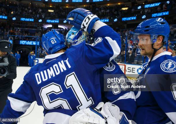 Gabriel Dumont and goalie Andrei Vasilevskiy of the Tampa Bay Lightning celebrate the win after the game against the Detroit Red Wings at Amalie...