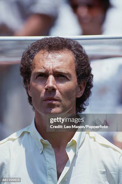 West Germany manager Franz Beckenbauer standing with the West Germany team during the anthems before the 1986 FIFA World Cup final game between...