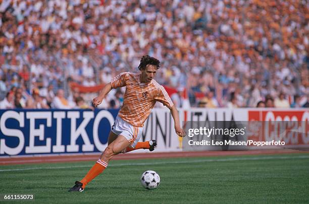 Dutch footballer Marco van Basten runs with the ball during the 1988 UEFA European Football Championship match between England and Holland at the...