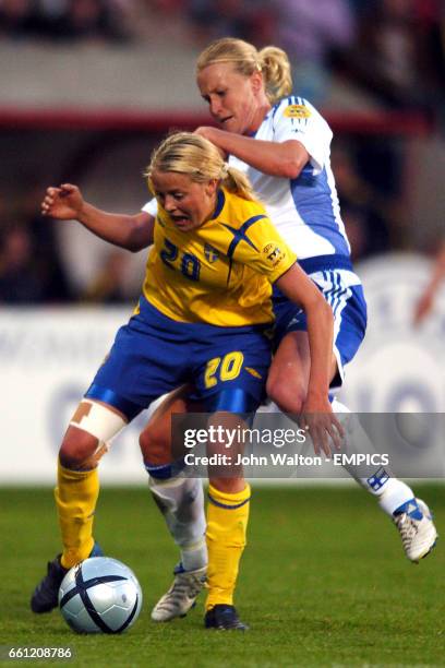 Sweden's Josephine Oqvist shields the ball from Finland's Anne Makinen