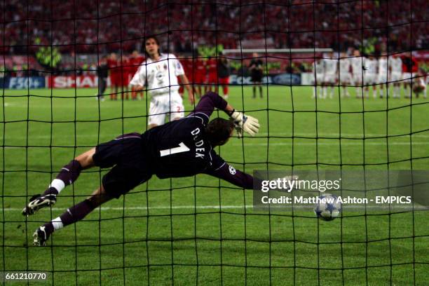 Liverpool's Jerzy Dudek saves a penalty in the shoot-out from AC Milan's Andrea Pirlo