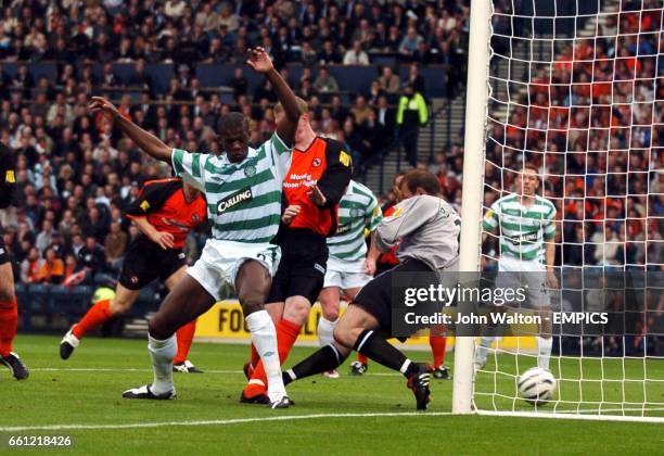 Celtic's Dianbobo Balde fails to connect with the ball as it goes past Dundee United's goalkeeper Tony Bullock direct from a free kick by Alan...