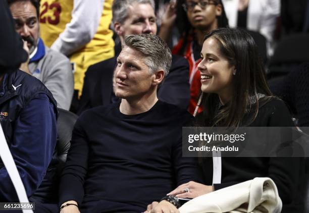 German football player Bastian Schweinsteiger and his wife Ana Ivanovic watch the NBA match between Chicago Bulls vs Cleveland Cavaliers at the...