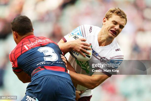 Tom Trbojevic of the Sea Eagles is tackled during the round five NRL match between the Sydney Roosters and the Manly Sea Eagles at Allianz Stadium on...