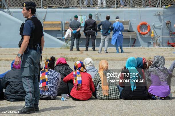 The migrants disembarked from the ship of the Italian Navy "Driade" in the port of Corigliano, on the coast of Calabria, southern Italy, on 8 June...