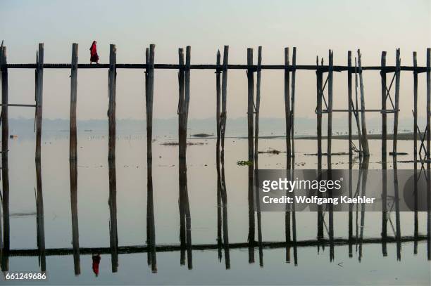 Bein Bridge reflecting in Taungthaman Lake near Amarapura, Mandalay, Myanmar.
