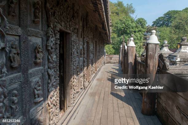 An exterior walkway with teak wood carvings at the Shwenandaw Monastery in Mandalay Hill, which was built in 1880 by King Thibaw Min with originally...