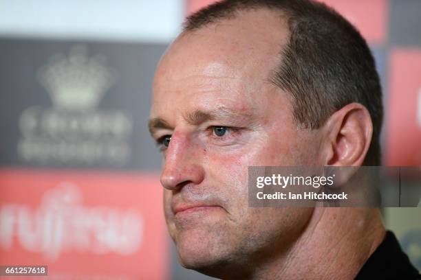 Rabbitohs coach Michael Maguire looks on during a television interview before the start of the round five NRL match between the North Queensland...