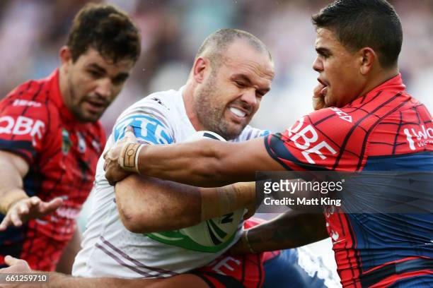 Nate Myles of the Sea Eagles is tackled during the round five NRL match between the Sydney Roosters and the Manly Sea Eagles at Allianz Stadium on...