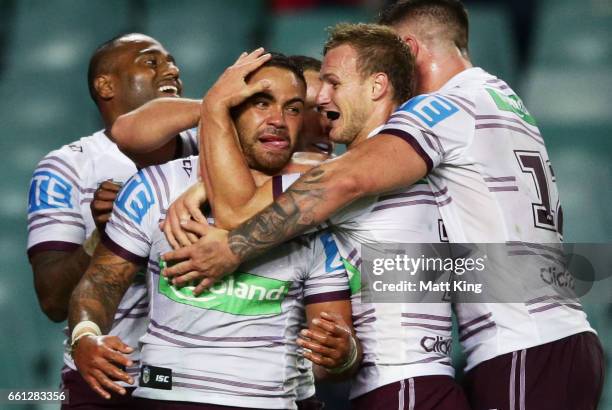 Dylan Walker of the Sea Eagles celebrates with team mates after scoring a try during the round five NRL match between the Sydney Roosters and the...