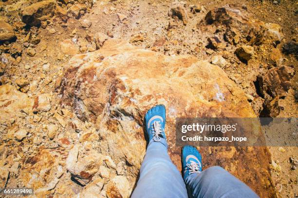 blue minimalist shoes on rust colored rock. - looking down at shoes stock pictures, royalty-free photos & images