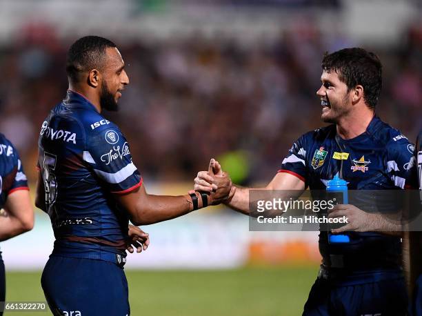 Gideon Gela-Mosby of the Cowboys celebrates after scoring a try with Lachlan Coote of the Cowboys during the round five NRL match between the North...
