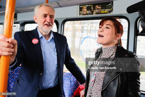 Labour leader Jeremy Corbyn speaks to fellow passengers as he takes a ride on the number 36 bus from Middlesbrough to Stockton on Tees on March 31,...