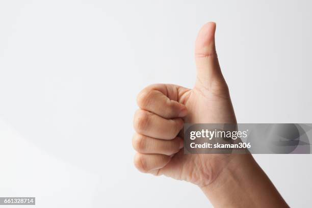 female hands show like or good  sign success and nice - daumen stock-fotos und bilder