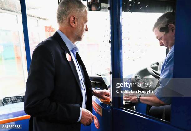 Labour leader Jeremy Corbyn pays his fair as he takes a ride on the number 36 bus from Middlesbrough to Stockton on Tees on March 31, 2017 in...