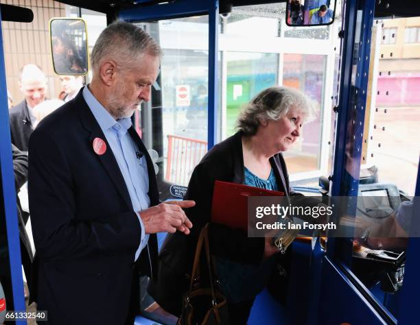 Labour leader Jeremy Corbyn pays his fair as he takes a ride on the number 36 bus from Middlesbrough to Stockton on Tees on March 31, 2017 in...