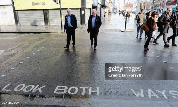 Labour leader Jeremy Corbyn speaks with Middlesbrough MP Andy McDonald as they walk through Stockton high street on March 31, 2017 in Middlesbrough,...