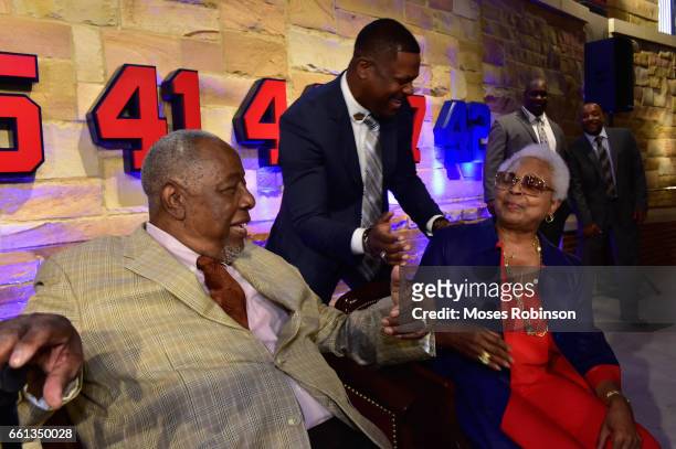 Comedian/Actor Chris Tucker greets Former MLB and Hall of Fame Player Hank Aaron and his wife Billye Aaron at the Atlanta Braves Unveil A New Statue...