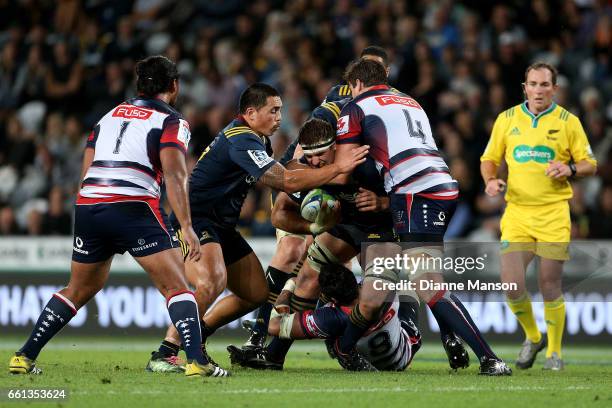 Luke Whitelock of the Highlanders tries to break the defence during the round six Super Rugby match between the Highlanders and the Rebels at Forsyth...