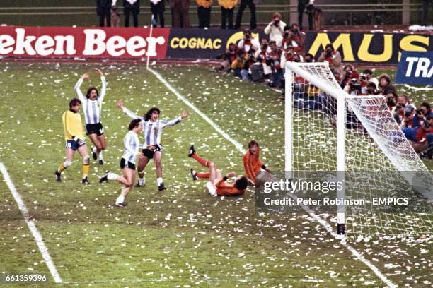 Argentina's Leopoldo Luque , Daniel Bertoni and Mario Kempes celebrate as the ball bounces into the net for Kempes', and Argentina's, second goal.