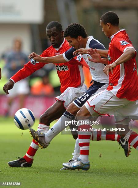 Charlton Athletic's Chris Powell and Jerome Thomas shut out Tottenham Hotspur's Aaron Lennon