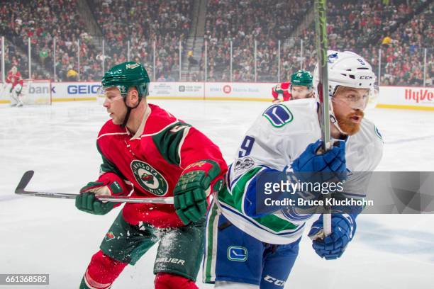 Christian Folin of the Minnesota Wild defends Jack Skille of the Vancouver Canucks during the game on March 25, 2017 at the Xcel Energy Center in St....