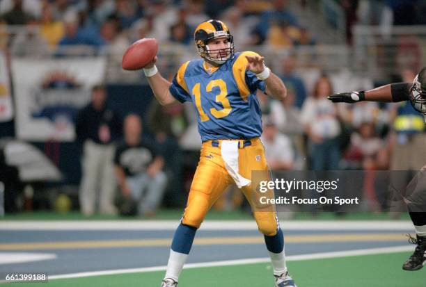 Kurt Warner of the St. Louis Rams drops back to pass against the Tampa Bay Buccaneers during an NFL football game November 26, 2001 at the Dome at...