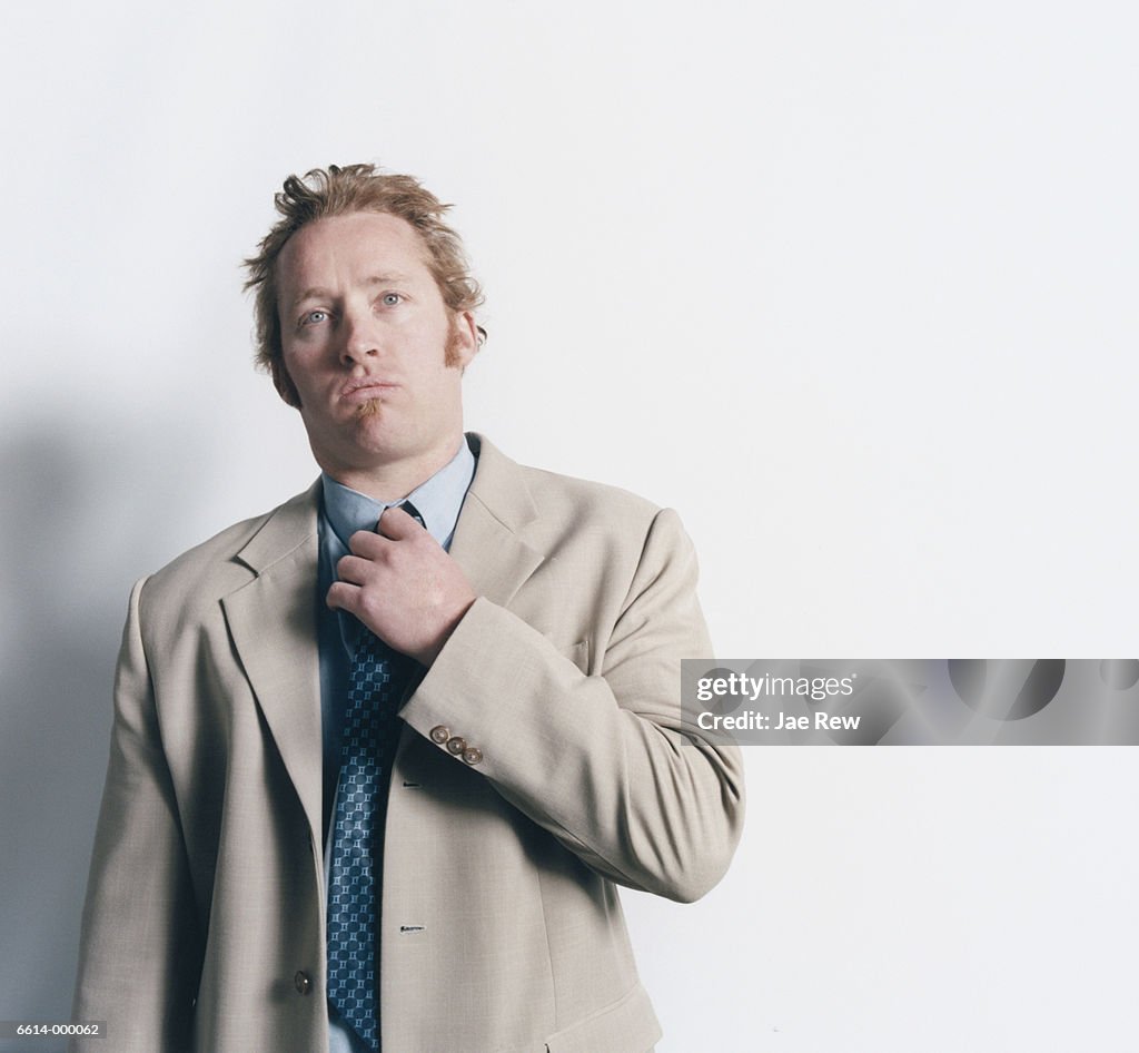 Businessman Loosening Tie