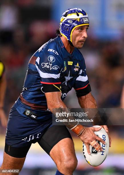 Johnathan Thurston of the Cowboys kicks the ball during the round five NRL match between the North Queensland Cowboys and the South Sydney Rabbitohs...