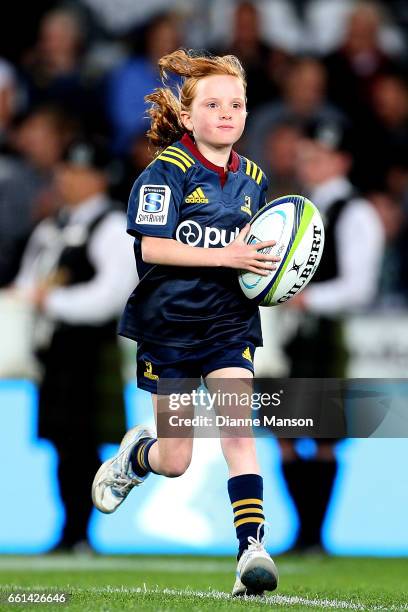 The Highlander ball girl makes her way out on to the field during the round six Super Rugby match between the Highlanders and the Rebels at Forsyth...