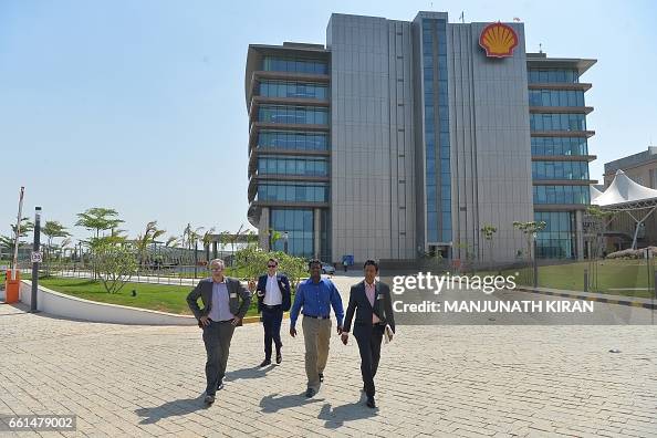 Participants walk through the Shell Technology Centre as it is opened ...