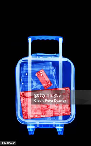 plane carry on luggage with laptop inside - airport x ray images stock pictures, royalty-free photos & images