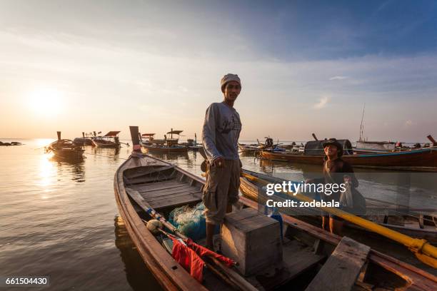 fisherman in thailand at sunset - thailandia stock pictures, royalty-free photos & images