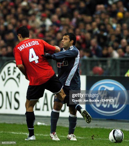 Benfica's Fabrizio Miccoli argues with Lille's Efstathios Tavlaridis