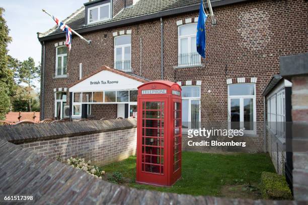 Traditional red British telephone box stands outside the Stonemanor British Store and Tea Rooms in Kortenberg, Belgium, on Friday, March 31, 2017....