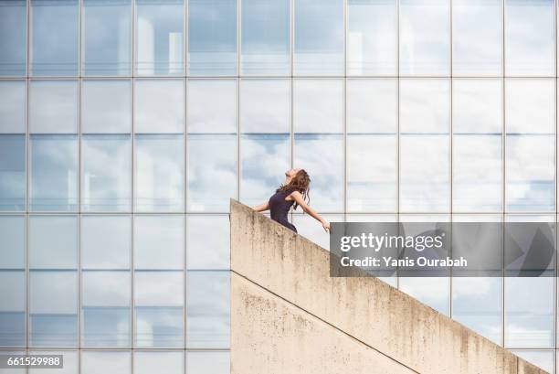 female ballet dancer dancing on a rooftop in lyon, france - collant ストックフォトと画像