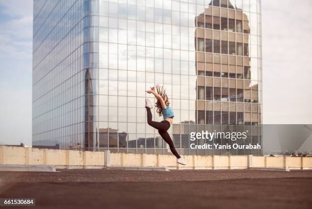 female ballet dancer dancing on a rooftop in lyon, france - collant ストックフォトと画像
