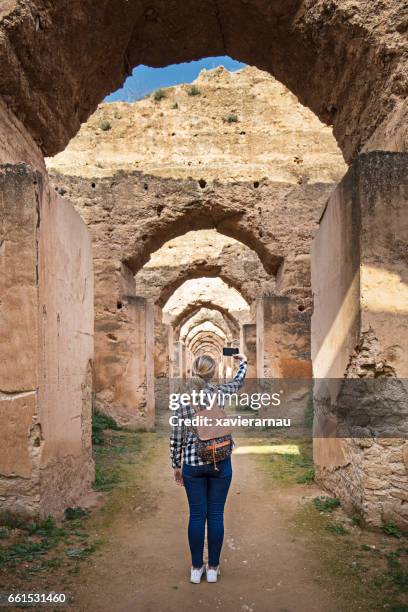 visiting old moroccan granary - meknes stock pictures, royalty-free photos & images