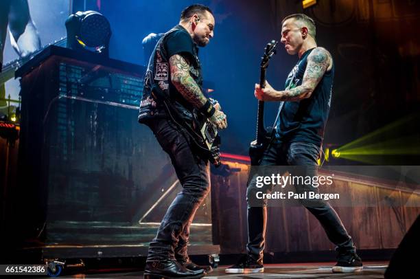 Danish rock band Volbeat with lead singer and guitarist Michael Poulsen and bassist Kaspar Boye Larsen performs at Ziggo Dome, Amsterdam,...