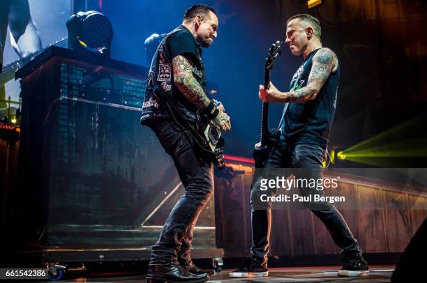 Danish rock band Volbeat with lead singer and guitarist Michael Poulsen and bassist Kaspar Boye Larsen performs at Ziggo Dome, Amsterdam,...