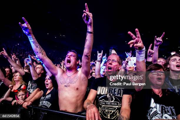Rock fans in the front row of the audience watching Danish rock band Volbeat at Ziggo Dome, Amsterdam, Netherlands, 15 November 2016.