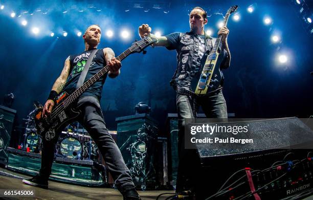 Danish rock band Volbeat with lead singer and guitarist Michael Poulsen and bassist Kaspar Boye Larsen performs at Ziggo Dome, Amsterdam,...