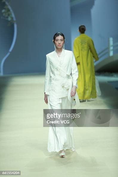 A model showcases designs on the runway at Heaven Gaia by Xiong Ying ...