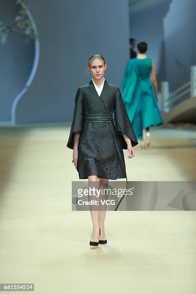 A model showcases designs on the runway at Heaven Gaia by Xiong Ying ...